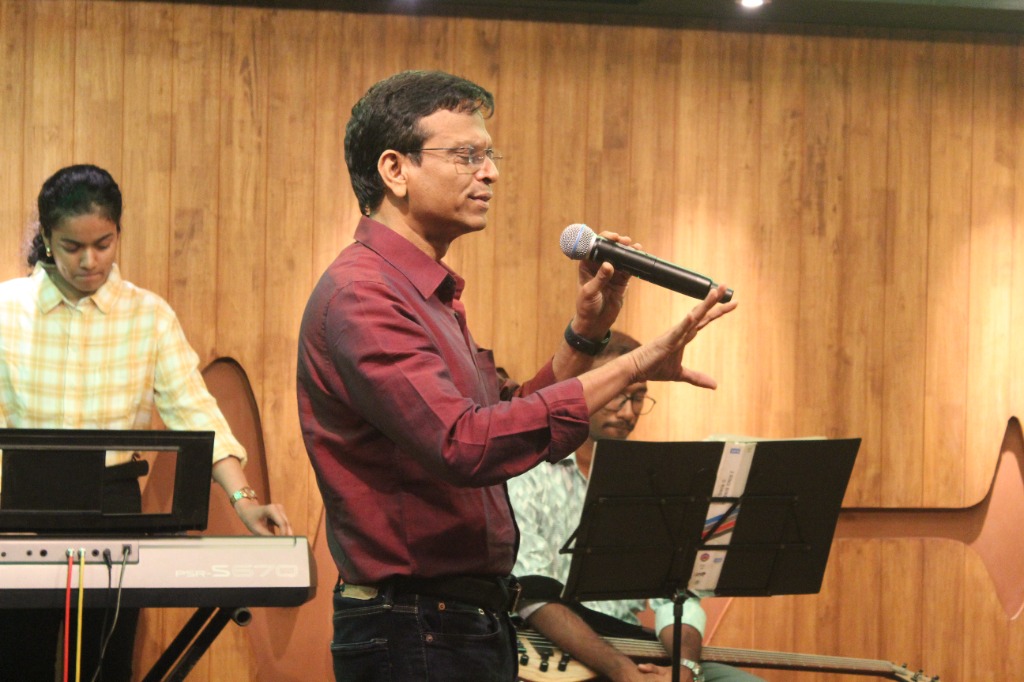 Michael Fernandes leading worship and prayer