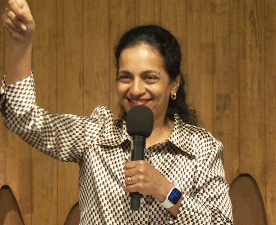 Shvetha Shetty ministering with a microphone